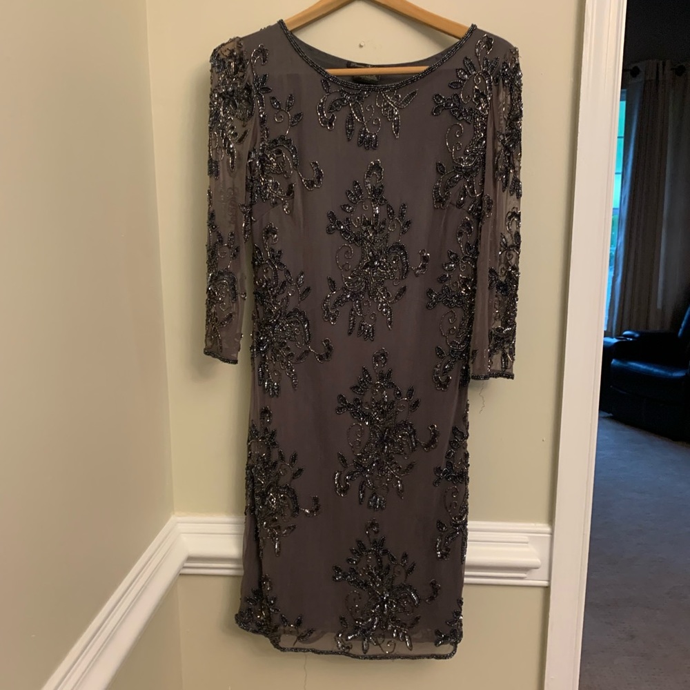 Beautifully beaded dress with see through arms, gorgeous design.